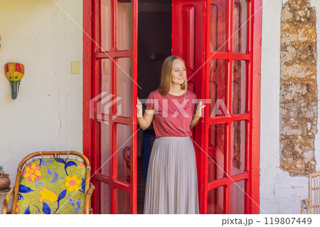 Female tourist in a colonial house in San Cristobal de las Casas, Mexico. Cultural exploration, architecture, and travel experience concept 119807449