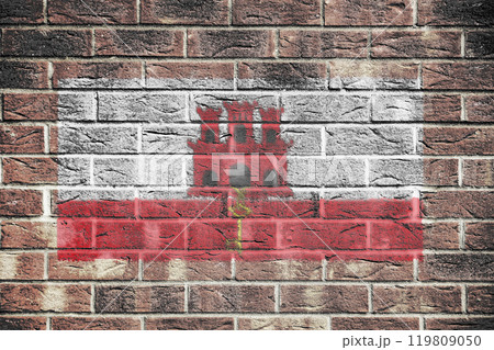 Gibraltar flag on brick wall background 119809050