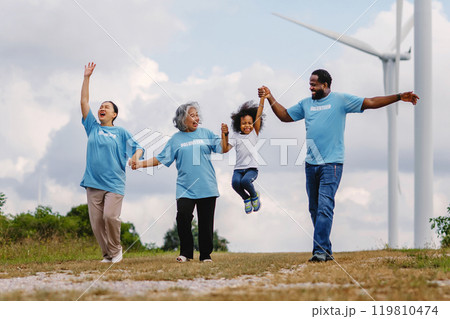 family of four, including a young child, are holding hands family of four, including a young child, are holding hands 119810474