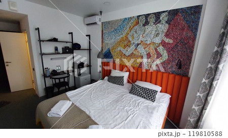 Hotel room with bed and mosaic 119810588