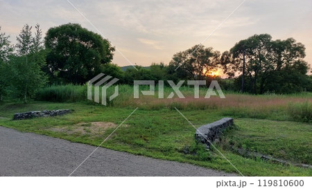 Ruined road and ruins on the outskirts of the city 119810600
