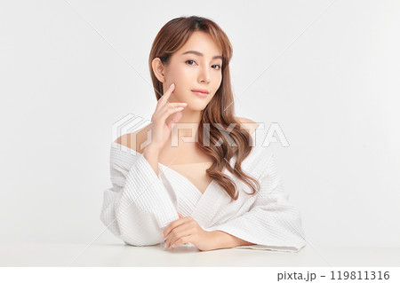 Beautiful young asian woman with clean fresh skin on white background, Face care, Facial treatment, Cosmetology, beauty and spa, Asian women portrait. Beautiful young asian woman with clean fresh skin on white background, Face care, Facial treatment, Cosmetology, beauty and spa, Asian women portrait. 119811316