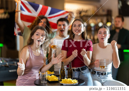 Group of fans in bar with British flag Group of fans in bar with British flag 119811331