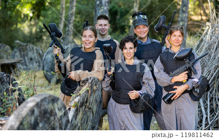 Group photo of cheerful male and female paintball players Group photo of cheerful male and female paintball players 119811462