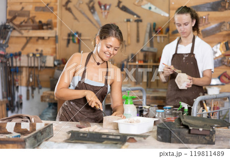 Guy is busy in carpentry workshop with female entrepreneur Guy is busy in carpentry workshop with female entrepreneur 119811489