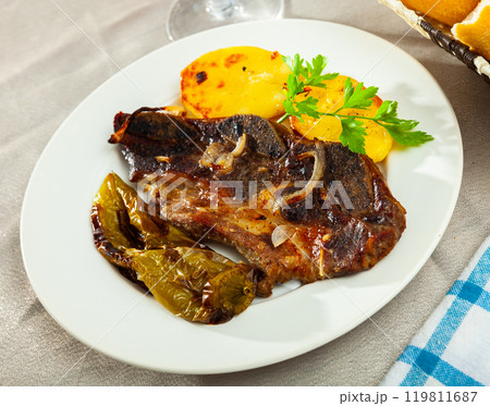 Popular dish of grilled beef Churrasco, potatoes and peppers 119811687