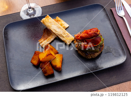 Hamburger with cutlet, pepper, ham, potatoes and white bread 119812125