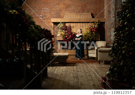 home young cozy celebration tree alone year woman holiday girl new fireplace christmas home young cozy celebration tree alone year woman holiday girl new fireplace christmas 119812357