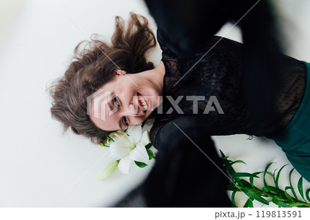 Beautiful woman taking pictures of herself on her smartphone and smiling 119813591