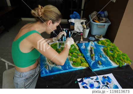 The process of making the art decor of epoxy resin, natural stones and moss 119813673