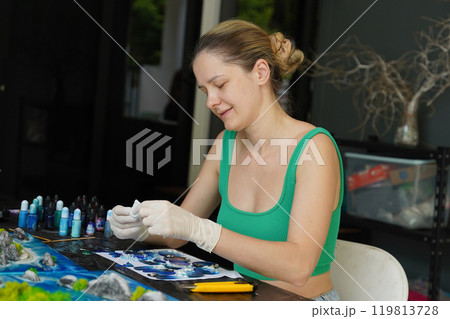 The process of making the art decor of epoxy resin, natural stones and moss 119813728