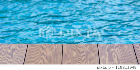 Wooden floor of swimming pool with customizable space for text or ideas. Copy space and holiday concept 119813949