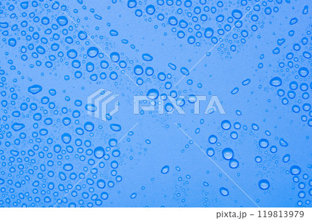 Top view of water droplets on blue gradient color cover background. Water droplets concept Top view of water droplets on blue gradient color cover background. Water droplets concept 119813979