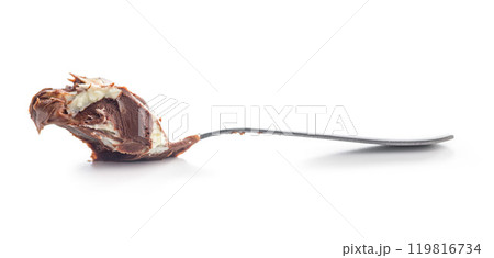 Chocolate cream spread on sppon isolated on white background. Chocolate cream spread on sppon isolated on white background. 119816734