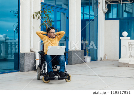 Man In Wheelchair Working Online Learning On Laptop 119817951