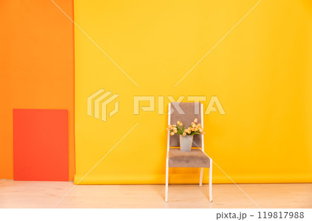 Grey Vintage Chair In The Interior Of A Yellow Orange Office 119817988