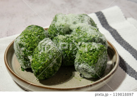 Frozen food spinach cubes homemade. Harvesting concept. Stocking up vegetables for winter storage Frozen food spinach cubes homemade. Harvesting concept. Stocking up vegetables for winter storage 119818897