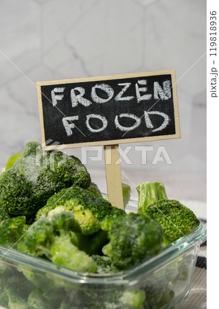 Frozen food broccoli florets with blackboard label and text FROZEN FOOD homemade. Harvesting concept. Stocking up vegetables for winter storage. Healthy food 119818936