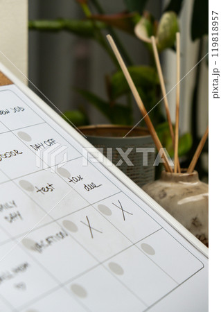 Monthly PLANNER filled with appointments and plans for next month. Busy month schedule Magnetic board with the days of the month. Place to enter important matters schedule. Concept for business 119818957