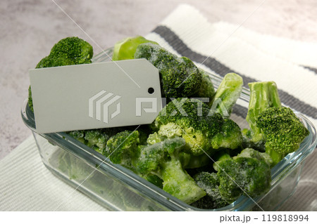 Frozen food broccoli florets with empty paper note copy space for text homemade. Harvesting concept. Stocking up vegetables for winter storage. Healthy food 119818994