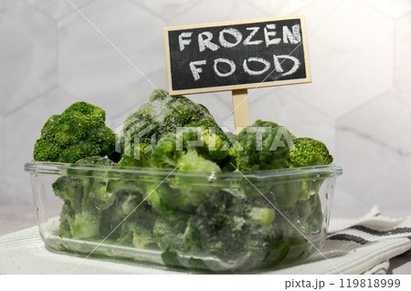 Frozen food broccoli florets with blackboard label and text FROZEN FOOD homemade. Harvesting concept. Stocking up vegetables for winter storage. Healthy food Frozen food broccoli florets with blackboard label and text FROZEN FOOD homemade. Harvesting concept. Stocking up vegetables for winter storage. Healthy food 119818999