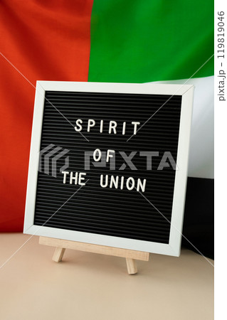Text SPIRIT OF THE UNION on background flag of UAE. National holiday of United Arab Emirates. Commemoration Day Muslim Arabian holidays. Dubai 119819046