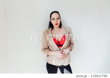 Beautiful plump brunette woman in a business suit 119821790