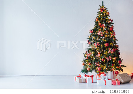 Decorating Christmas Tree with Gifts and Toys Interior New Year 119821995