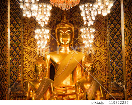 Serene golden Buddha statue in a Thai temple. Serene golden Buddha statue in a Thai temple. 119822225