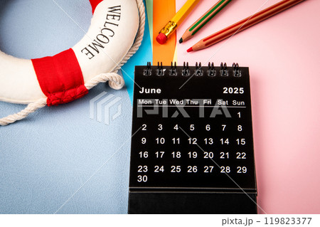 JUNE 2025. Monthly desk calendar for 2025 year. Colorful sheets of paper on the office table 119823377