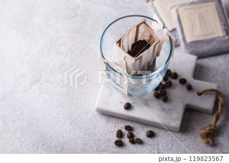 Freshly brewed drip coffee in glass cup Freshly brewed drip coffee in glass cup 119823567