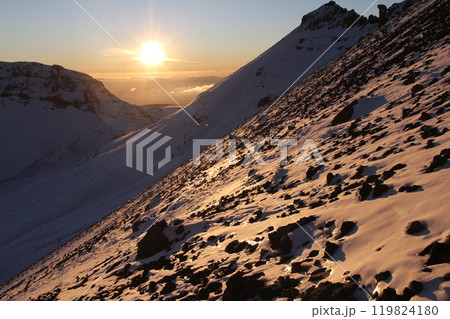 Breathtaking Rocky Mountain Slope Bathed in Morning Sunlight with Snow-Capped Peaks Nearby Breathtaking Rocky Mountain Slope Bathed in Morning Sunlight with Snow-Capped Peaks Nearby 119824180