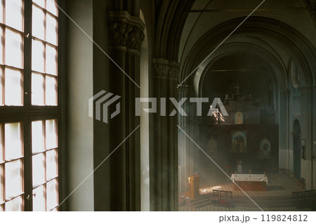 High angle shot of amazing and majestic nave with huge columns and arcades with light fog in air 119824812