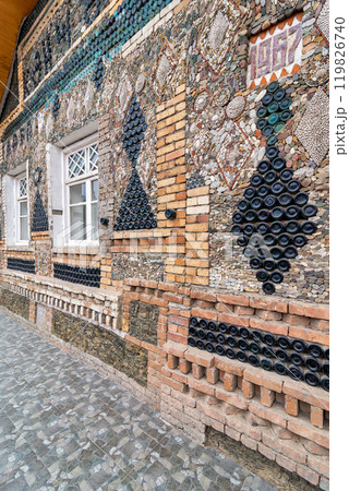 Explore the Unique Bottle House Showcasing Colorful Bottle Integration in Ganja, Azerbaijan on a Sunny Day Explore the Unique Bottle House Showcasing Colorful Bottle Integration in Ganja, Azerbaijan on a Sunny Day 119826740