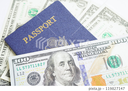 US passport issued to citizen and national of the United States of America to travel in most countries outside with USA flag and dollar money. US passport issued to citizen and national of the United States of America to travel in most countries outside with USA flag and dollar money. 119827147