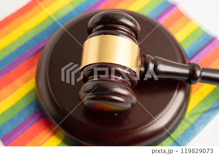 Gavel for judge lawyer on rainbow flag, symbol of LGBT pride month. 119829073