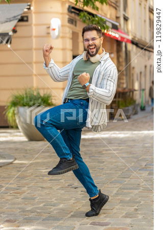 Excited happy man shouting, celebrating success, winning, goal achievement on urban city street Excited happy man shouting, celebrating success, winning, goal achievement on urban city street 119829447