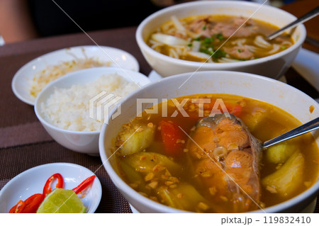 Fish soup with red fish Finnish fish soup with red fish with spices and fresh dill on a dark stone background. Top view with copy space. Fish soup with red fish Finnish fish soup with red fish with spices and fresh dill on a dark stone background. Top view with copy space. 119832410