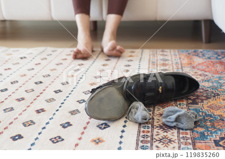 dirty sock and shoe on floor  119835260
