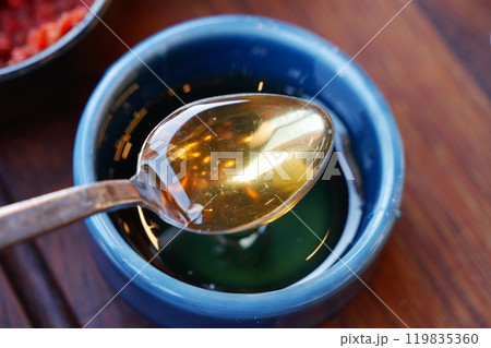Golden Honey, lovingly drizzled over a beautifully presented saucer of white, creamy substance Golden Honey, lovingly drizzled over a beautifully presented saucer of white, creamy substance 119835360