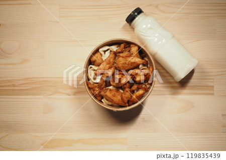 Enjoy a tasty Chicken Bowl with flavorful noodles and creamy sauce to satisfy your cravings 119835439