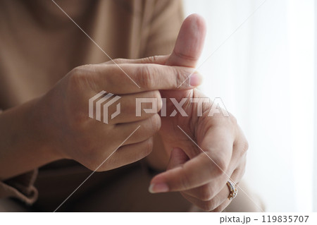 Young women suffering finger pain  119835707