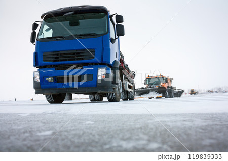 Machine for distribution of liquid anti-icing reagents on runway and snowplows cleans the airfield 119839333