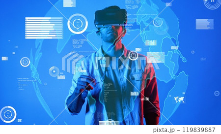 Smart man wearing VR glasses and casual cloth while looking at chart. Apparatus. Smart man wearing VR glasses and casual cloth while looking at chart. Apparatus. 119839887