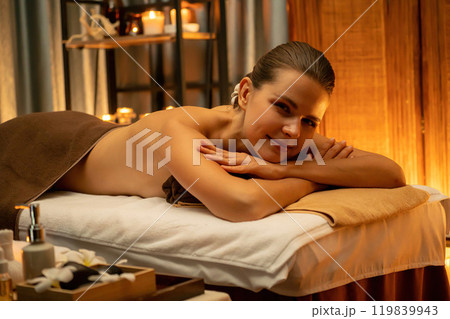 Caucasian woman customer enjoying relaxing anti-stress massage. Quiescent Caucasian woman customer enjoying relaxing anti-stress massage. Quiescent 119839943
