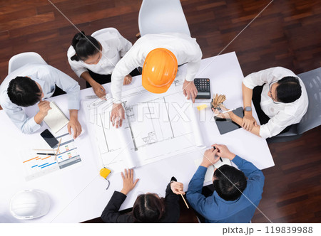 Diverse group of civil engineer and client working on architect. Prudent 119839988