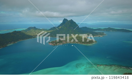 Stunning beauty of Bora Bora island helicopter. Tropical island panorama, coral reef atoll with turquoise lagoon and mount otemanu dominating ocean landscape. Remote wild nature paradise. Aerial shot 119843418