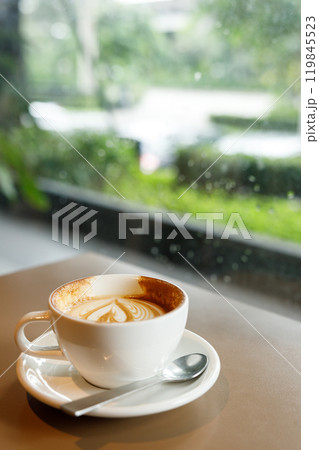 Cup of hot latte coffee on table Cup of hot latte coffee on table 119845523