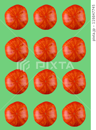 Vibrant red citrus slices on green background 119847745
