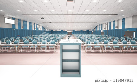 A spacious conference hall with rows of chairs and a podium 119847913